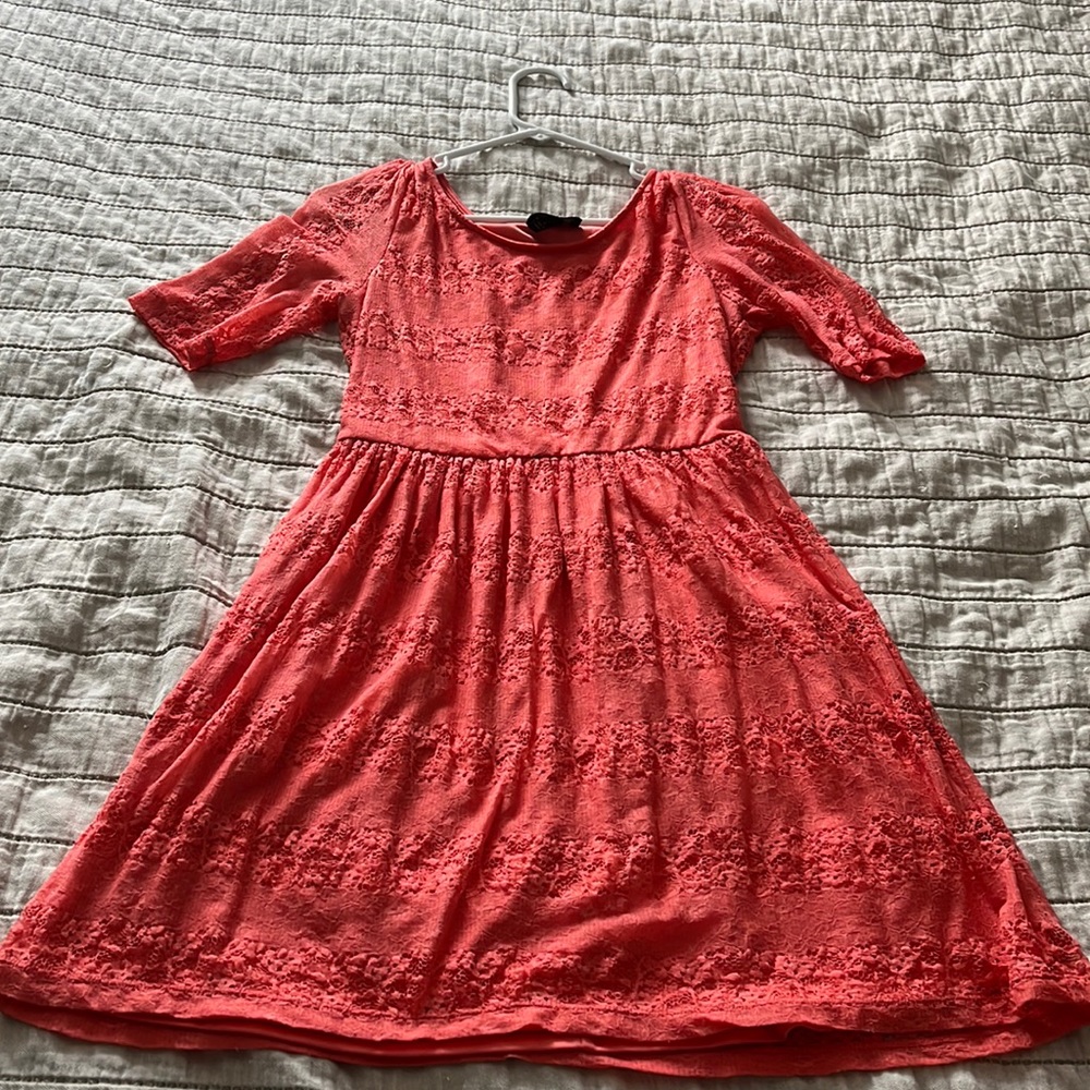 Peachy colored large lacy dress